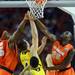 Michigan freshman Mitch McGary attempts a basket around Syracuse junior C.J. Fair and sophomore Rakeem Christmas during the first half at the Final Four in Atlanta on Saturday, April 6, 2013. Melanie Maxwell I AnnArbor.com